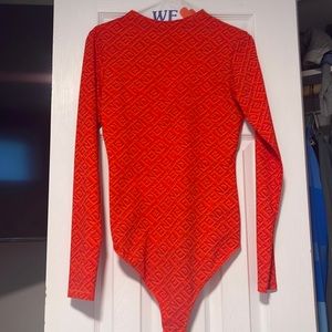 Orange body suit SKIMS x Fendi